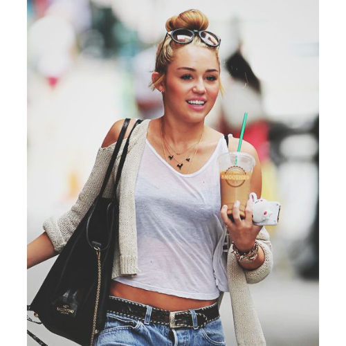 Miley Cyrus drinking a smoothie